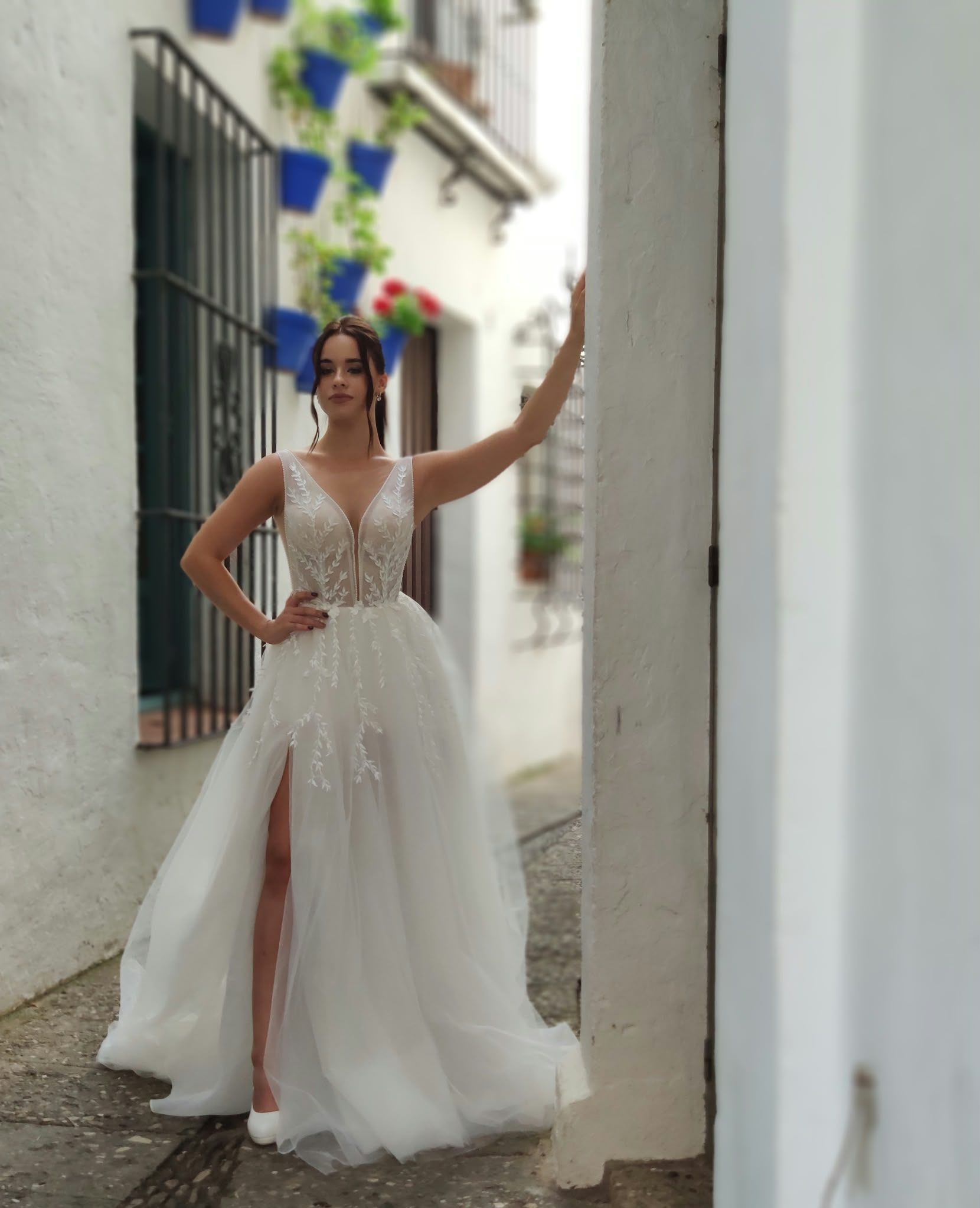 Lace A-line wedding dress with V-neck and skirt slit — Oksana Dorenska