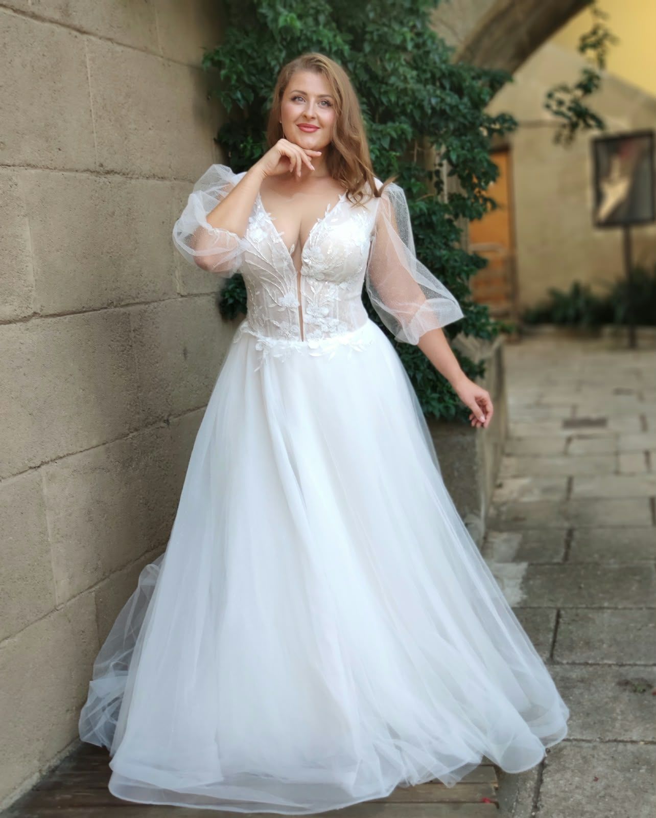 A-line wedding dress with deep V-neck and puffed tulle half sleeves — Oksana Dorenska